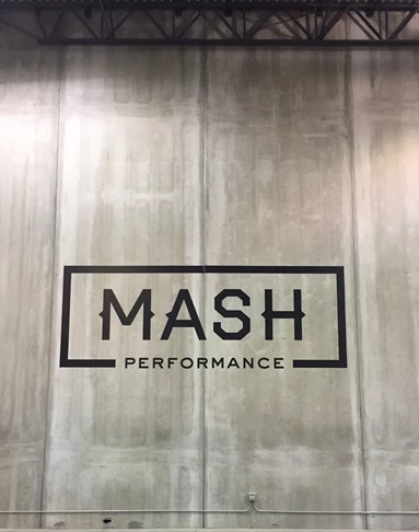 MASH vinyl logo on concrete wall - 13.5 feet high
