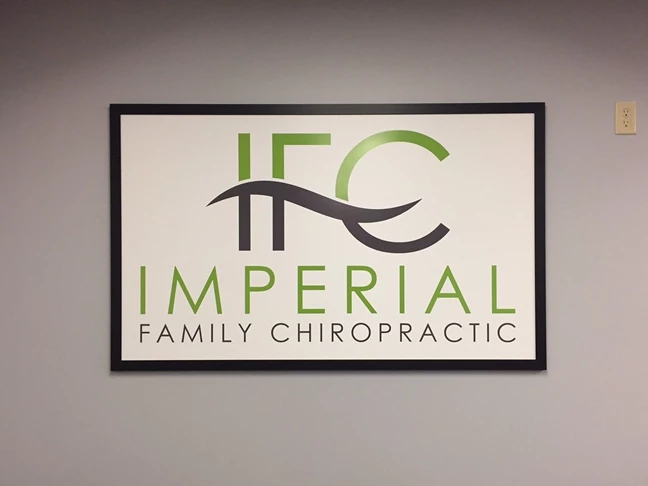 Interior wall sign at Imperial Family Chiropractic in Farmington, MN, framed sign